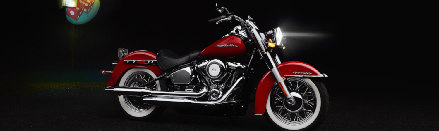 Red 2023 Harley-Davidson® motorcycle against a black background